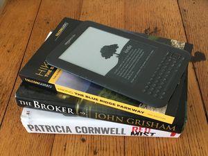 stack of books and a Kindle e-reader